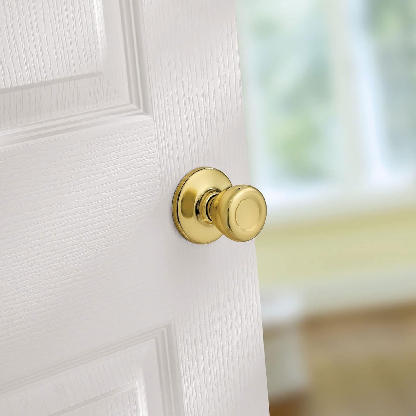 Kwikset Tylo Interior Passage Door Knob in Polished Brass for Closet and Hallway Doors