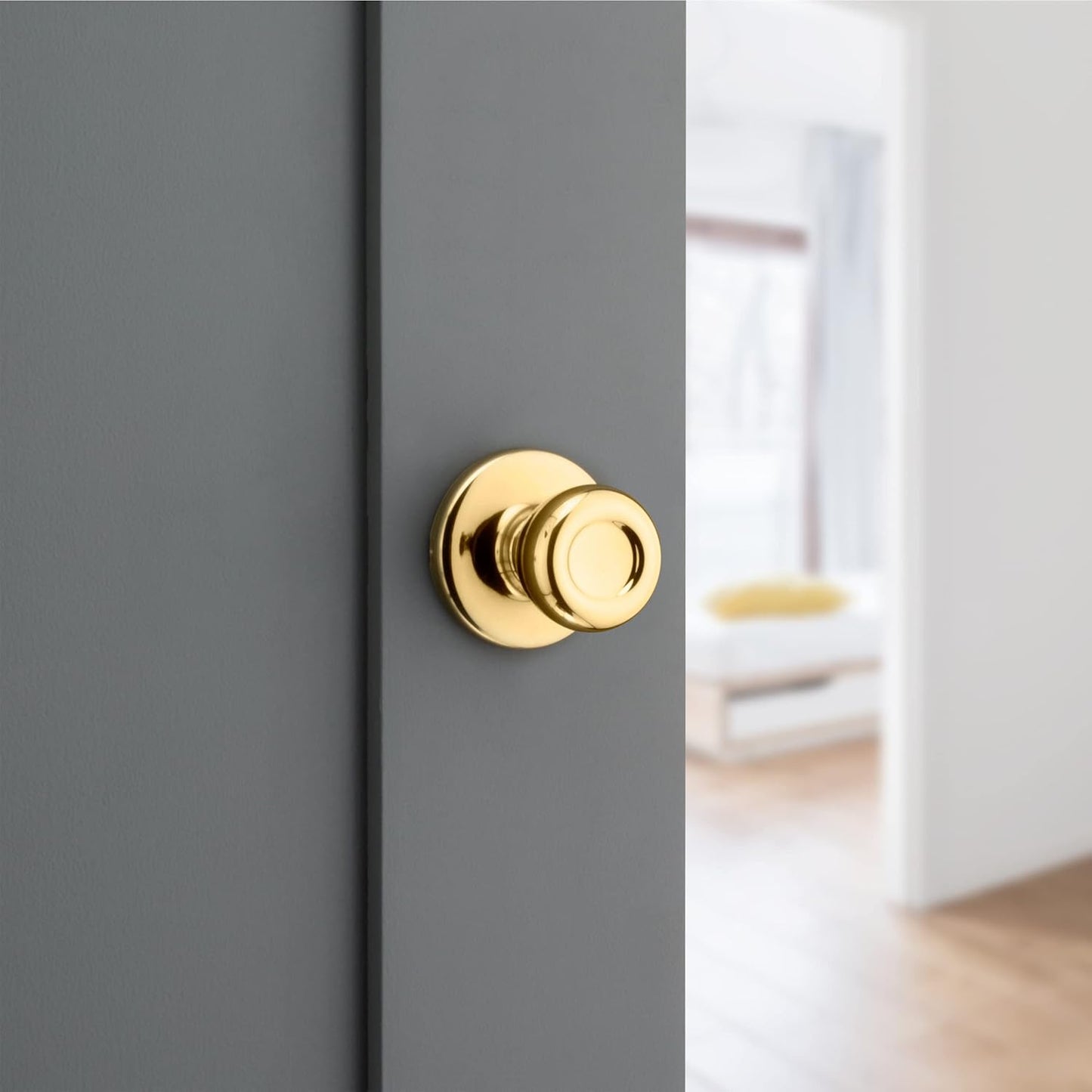 Kwikset Tylo Interior Passage Door Knob in Polished Brass for Closet and Hallway Doors