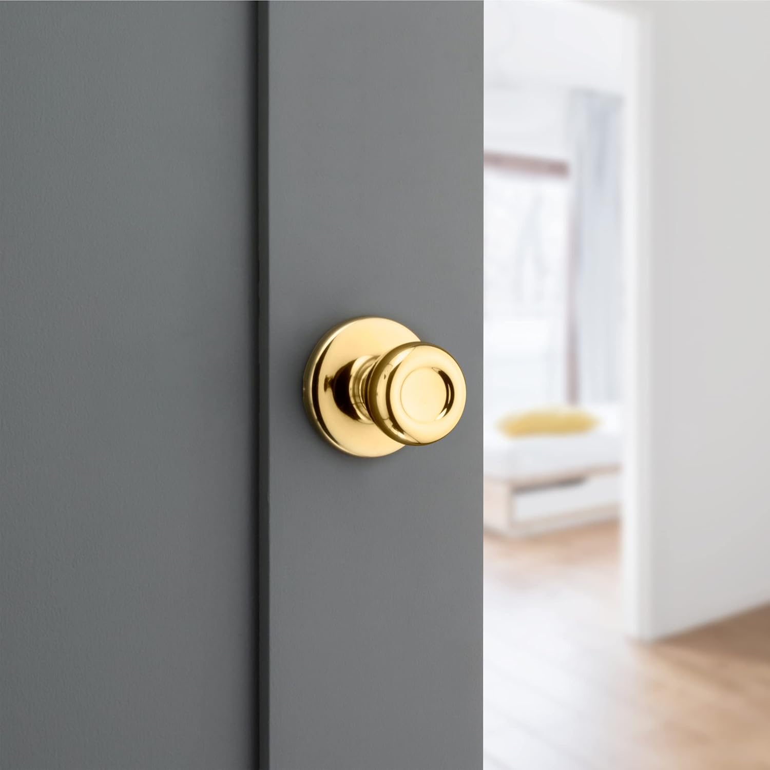 Kwikset Tylo Interior Passage Door Knob in Polished Brass for Closet and Hallway Doors