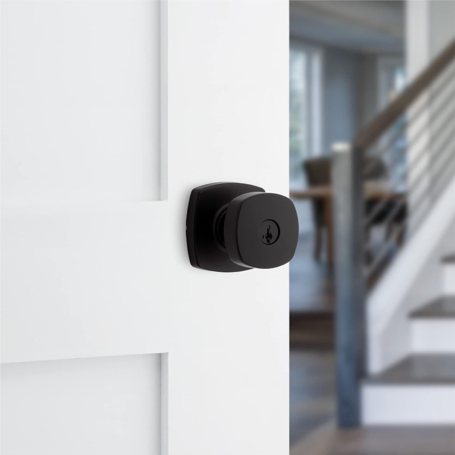 Secure your home with the Kwikset Arroyo Knob Entry Door Lock and Key in Matte Black, featuring SmartKey Rekey Security and Microban technology for added protection. Perfect for front entrances and bedrooms.
